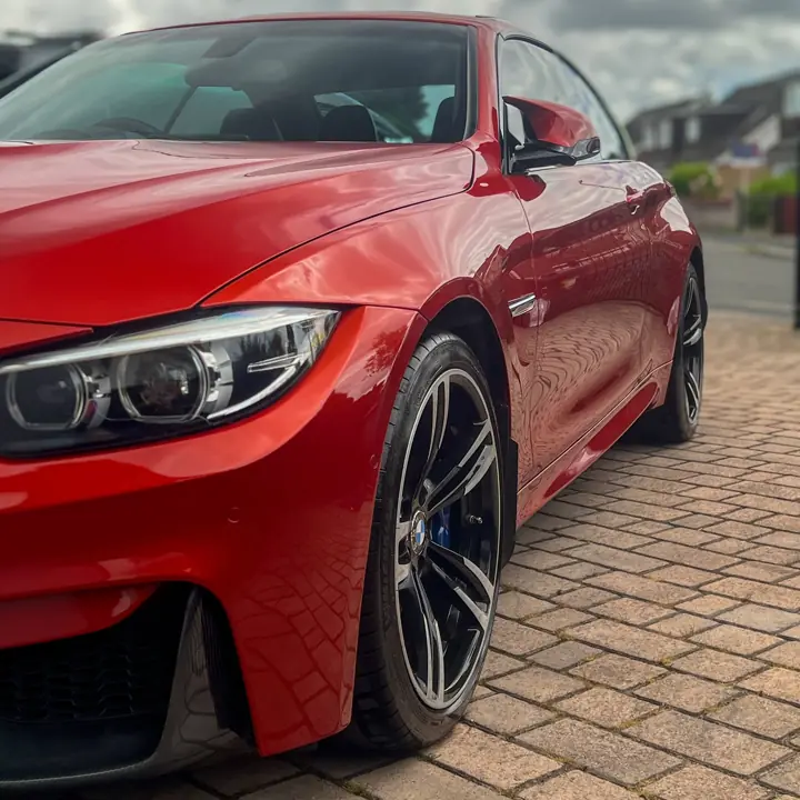 BMW M4 in red after a paint enhancement detail