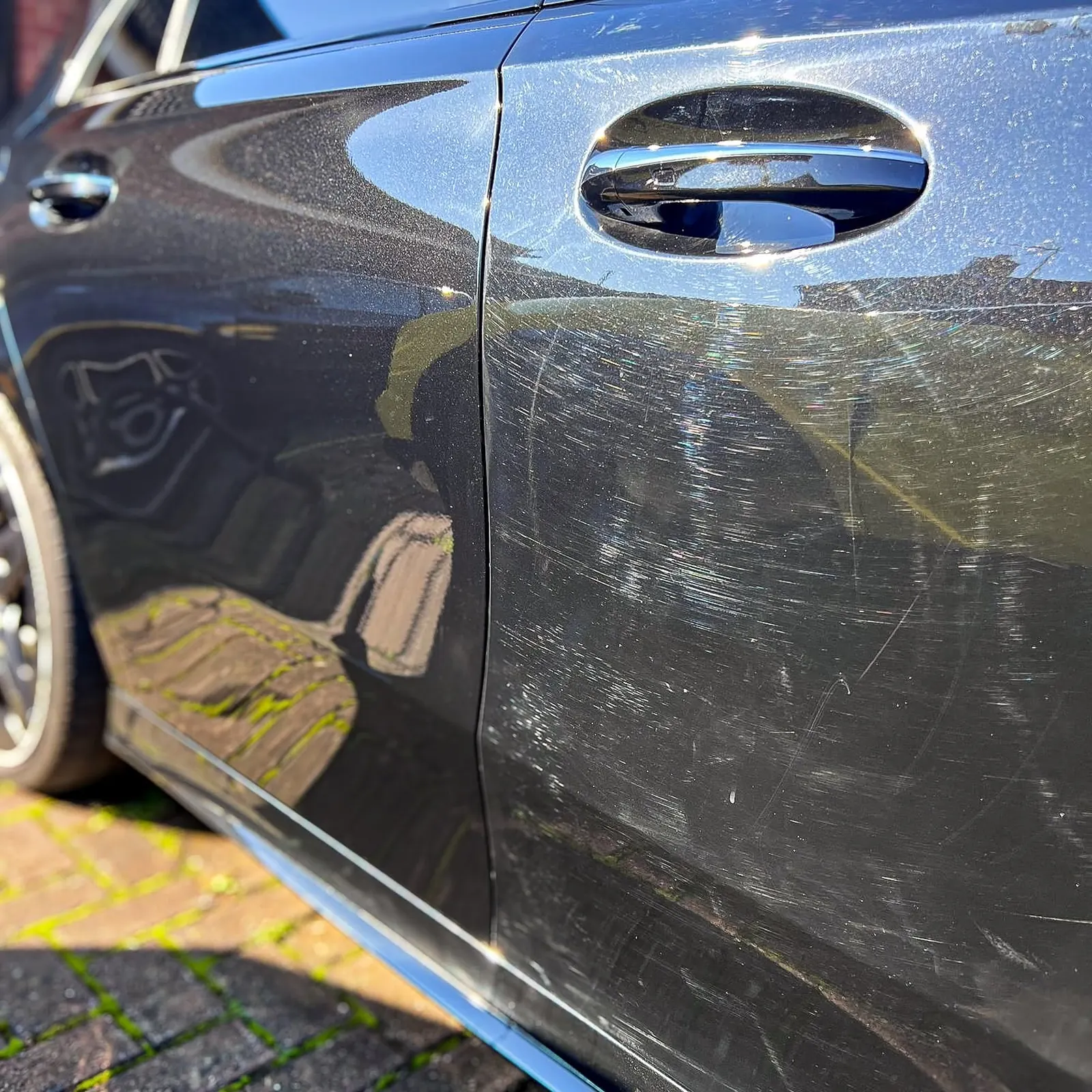 Mercedes door: left half machine polished and swirl-free, right half untouched with swirl marks